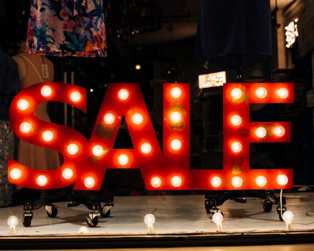 glowing-signboard-sale-store_23-2148184248