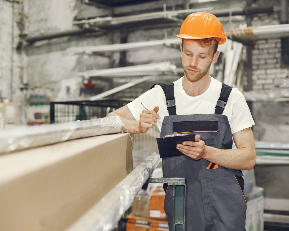 industrial-worker-indoors-factory-young-technician-with-orange-hard-hat_1157-40892