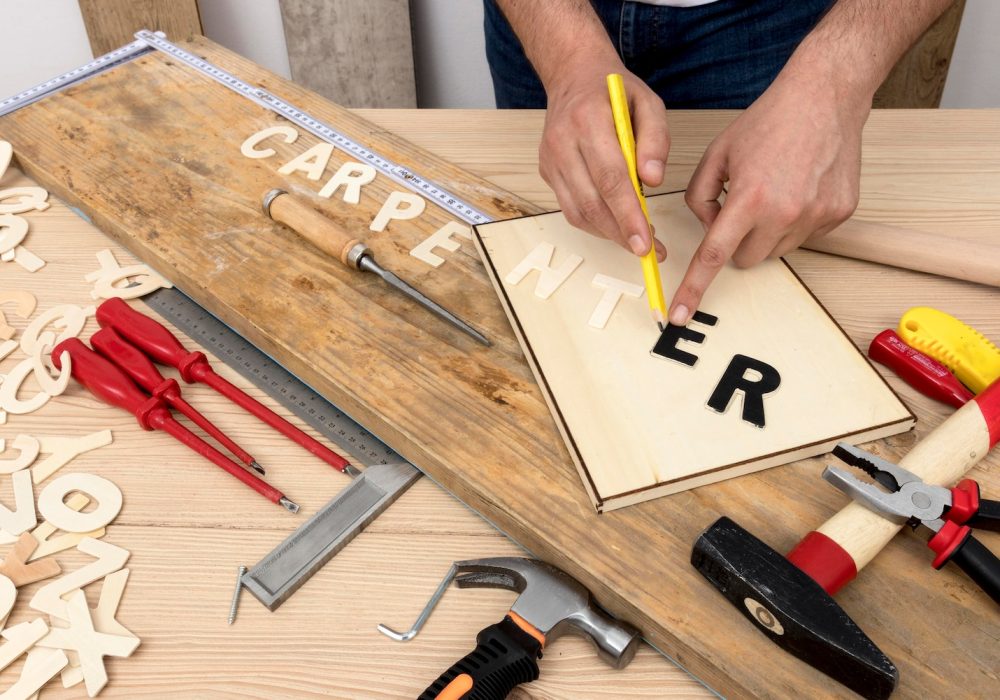 person-using-tools-create-carpentry-word_23-2148640311